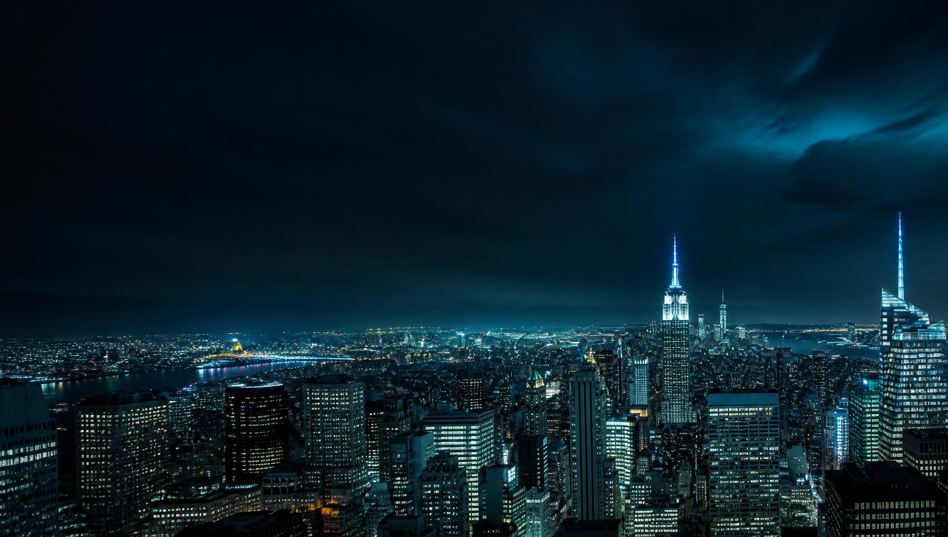 New York City financial district skyline at night, the setting for our trading research desk